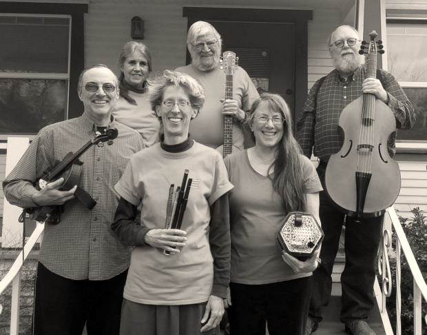 Black and white image of a band holding their instruments
